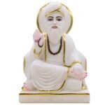 White statue with gold accents