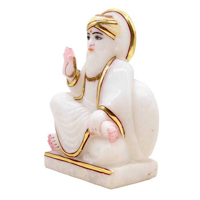 White decorative statue with gold accents