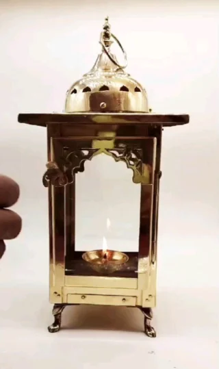 "Embrace the divine glow with our Brass Lantern Diya 🪔✨ Perfect for illuminating your sacred space with warmth and reverence. Light up your worship rituals with timeless elegance. #BrassDiya #SacredIllumination #DivineGlow"#swayambhumumbai#SwayambhuStore